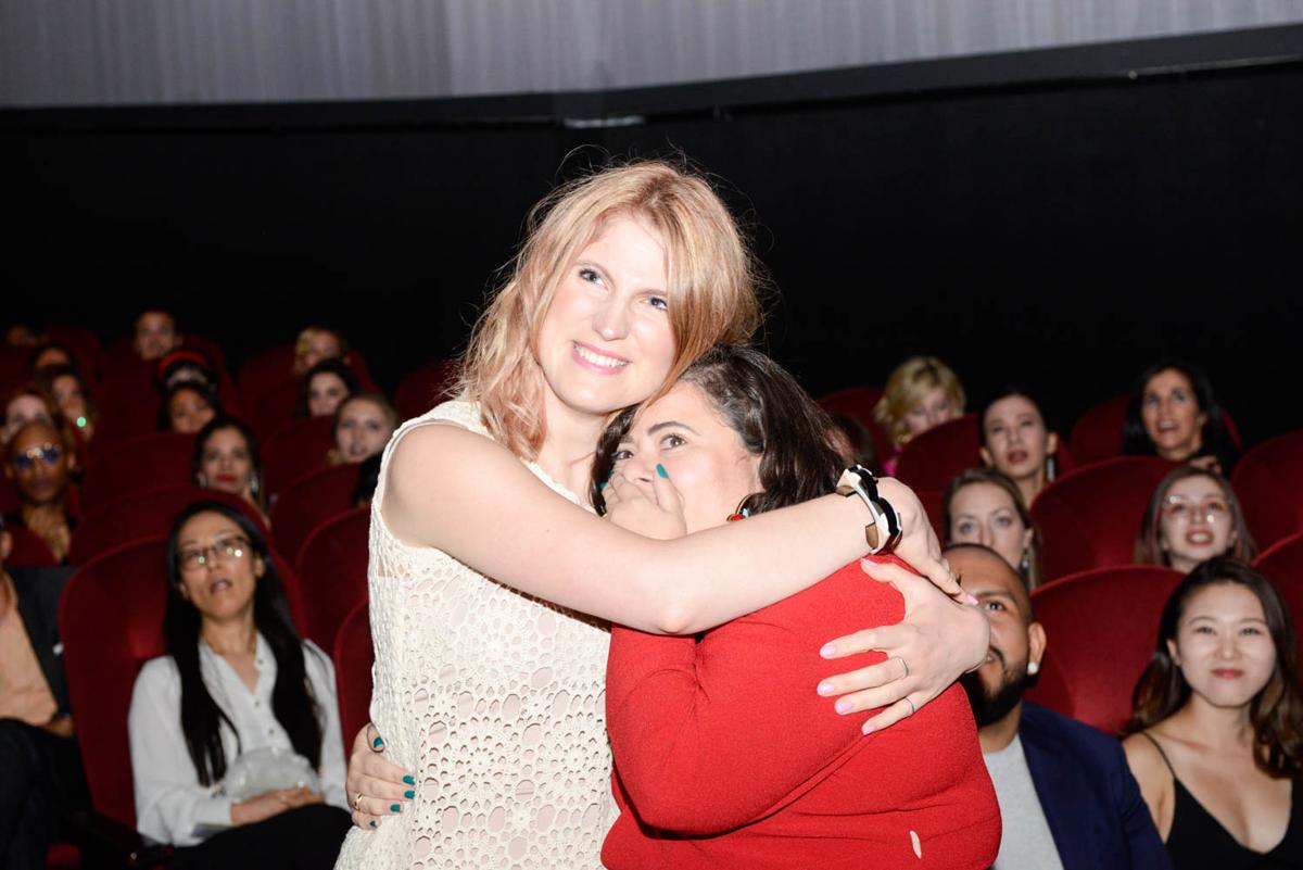 IHDA Winners on stage From Belo Charlotte Bingham Wallis and Maria Costa emotionally watching their video