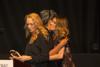 Julee Wilson of Essence presenting Iconoclast award to Monica Zwirner and Lucy Wallace Eustice of MZWallace 